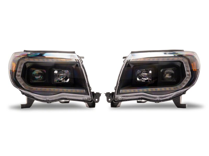 Raxiom 05-11 ToyotaTacoma Axial Series Switchback Projector Headlights- Black Housing- Clear Lens