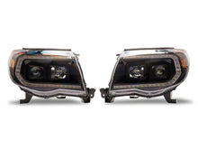Load image into Gallery viewer, Raxiom 05-11 ToyotaTacoma Axial Series Switchback Projector Headlights- Black Housing- Clear Lens