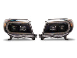 Raxiom 05-11 ToyotaTacoma Axial Series Switchback Projector Headlights- Black Housing- Clear Lens