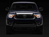 Raxiom 12-15 Toyota Tacoma Axial Series Headlights/Seq LED Bar- Black- Clear Lens
