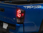 Raxiom 16-23 Toyota Tacoma XW Series Sequential LED Tail Lights- Black Housing- Clear Lens