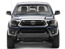 Load image into Gallery viewer, Raxiom 12-15 ToyotaTacoma Axial Series Switchback Projector Headlights- Black Housing- Clear Lens