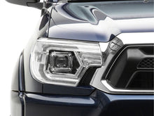 Load image into Gallery viewer, Raxiom 12-15 Toyota Tacoma Axial Series Switchback Projector Headlights- Chrome- Clear Lens