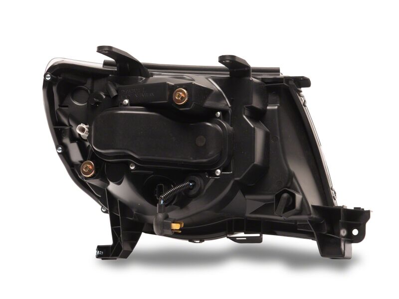 Raxiom 05-11 ToyotaTacoma Axial Series Switchback Projector Headlights- Black Housing- Clear Lens