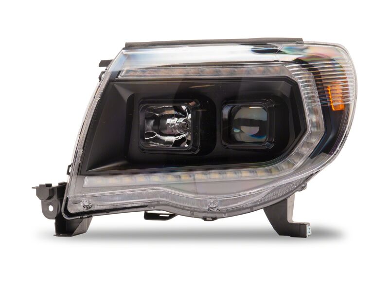 Raxiom 05-11 ToyotaTacoma Axial Series Switchback Projector Headlights- Black Housing- Clear Lens