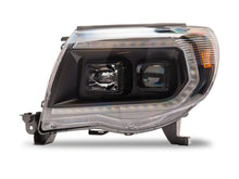 Load image into Gallery viewer, Raxiom 05-11 ToyotaTacoma Axial Series Switchback Projector Headlights- Black Housing- Clear Lens