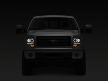 Load image into Gallery viewer, Raxiom 09-14 Ford F-150 G2 Super White LED Halo Projector Headlights- Black Housing- Clear Lens