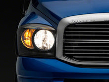 Load image into Gallery viewer, Raxiom 06-08 Dodge RAM 1500 Axial Series Euro Headlights- Black Housing- Clear Lens
