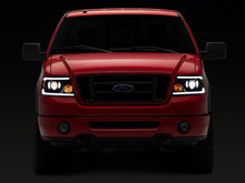 Load image into Gallery viewer, Raxiom 04-08 Ford F-150 Axial Series Projector Headlights with LED Bar- Black Housing- Clear Lens