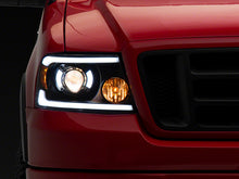 Load image into Gallery viewer, Raxiom 04-08 Ford F-150 Axial Series Projector Headlights with LED Bar- Black Housing- Clear Lens