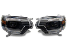 Load image into Gallery viewer, Raxiom 12-15 ToyotaTacoma Axial Series Switchback Projector Headlights- Black Housing- Clear Lens
