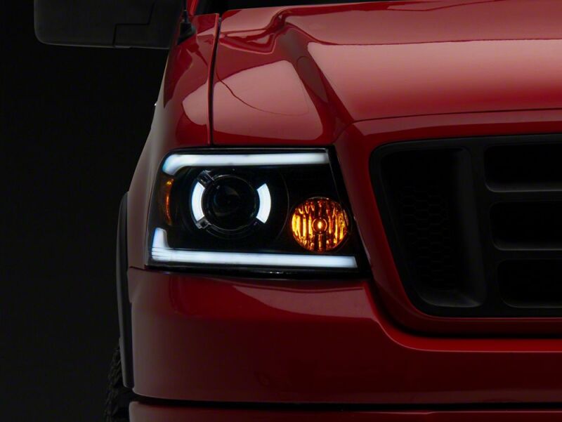 Raxiom 04-08 Ford F-150 Axial Series LED Proj Hlights/Seq LED Bar- Black- Clear Lens