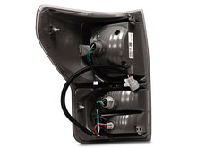 Load image into Gallery viewer, Raxiom 07-13 Toyota Tundra Axial Series Dual C-Shape LED Tail Lights- Black Housing- Smoked Lens