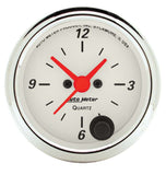 Traditional incandescent lighting illuminates around the perimeter of the dial