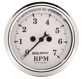 Traditional incandescent lighting illuminates around the perimeter of the dial