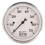 Traditional incandescent lighting illuminates around the perimeter of the dial