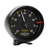 Traditional incandescent lighting illuminates around the perimeter of the dial