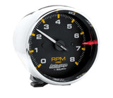 Traditional incandescent lighting illuminates around the perimeter of the dial