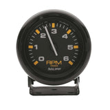Traditional incandescent lighting illuminates around the perimeter of the dial