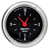 Traditional incandescent lighting illuminates around the perimeter of the dial