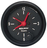 Traditional incandescent lighting illuminates around the perimeter of the dial