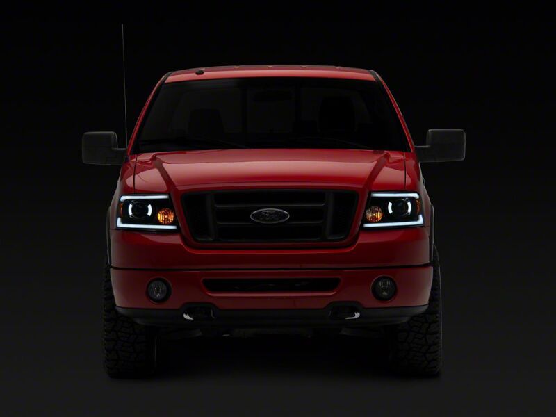 Raxiom 04-08 Ford F-150 Axial Series LED Proj Hlights/Seq LED Bar- Black- Clear Lens