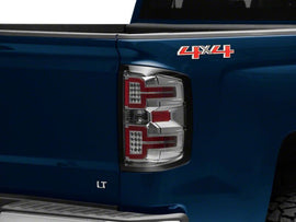 Raxiom 14-18 Chevrolet Silverado 1500 LED TailLights/SeqTurn Signals- Chrome- Smoked Lens