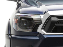 Load image into Gallery viewer, Raxiom 12-15 ToyotaTacoma Axial Series Switchback Projector Headlights- Black Housing- Clear Lens