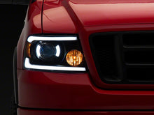 Load image into Gallery viewer, Raxiom 04-08 Ford F-150 Axial Series Projector Headlights with LED Bar- Black Housing- Clear Lens