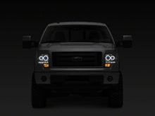 Load image into Gallery viewer, Raxiom 09-14 Ford F-150 G2 Super White LED Halo Projector Headlights- Black Housing- Clear Lens