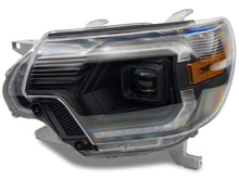 Load image into Gallery viewer, Raxiom 12-15 ToyotaTacoma Axial Series Switchback Projector Headlights- Black Housing- Clear Lens